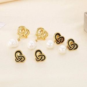 Vintage heart knot pearl earrings set in gold and black enamel for a classic royal style