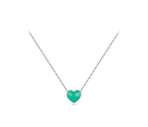 Close-up of mint green enamel heart pendant with elegant silver chain necklace