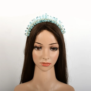 Detail of natural blue crystal clusters hand-wrapped on a golden bridal tiara