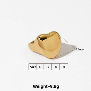 Detailed view of large golden heart signet ring with 22mm width and 9.8g weight