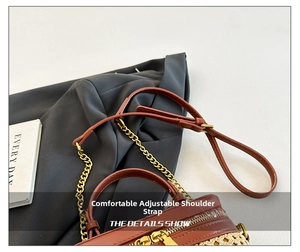 Detail view of the adjustable brown leather strap and golden hardware on bamboo bag