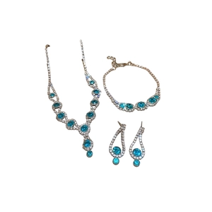 Elegant silver jewelry set with blue gemstone necklace, bracelet and earrings