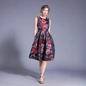 Elegant sleeveless floral print dress with a cinched waist and pleated satin skirt