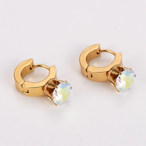 Macro detail of French vintage gold hoop earrings featuring large round colorful zircon stones