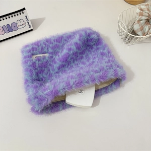 Detailed view of plush purple leopard print makeup bag with soft faux fur texture