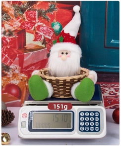 Detail of a plush Santa Claus candy basket weighing 151g for Christmas table decoration