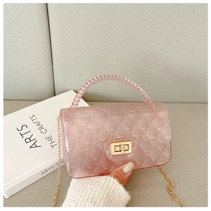 Pink transparent jelly bag with diamond texture, gold chain and beaded handle detail