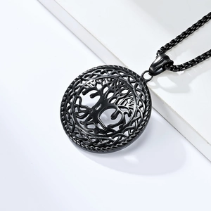 Detail of a vintage black hollow Tree of Life pendant with woven edge on square chain
