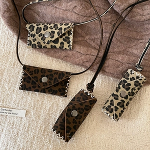 Leopard print mini leather pouch necklaces with handmade stitching and silver buckle detail
