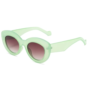 Retro y2k cat eye sunglasses with translucent light green frame and brown gradient lens