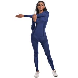 Women's dark blue seamless yoga set showing high-stretch breathable jacquard fabric