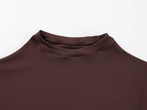 Detail of high-elasticity mock neck stitching and knit fabric in dark brown