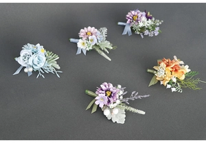 Set of five elegant silk boutonnières in pastel colors for weddings and formal events