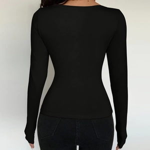 Detail view of the slim fit back design on this black long sleeve ribbed knit T-shirt
