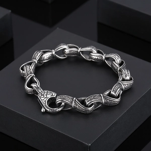 Detail of vintage titanium steel men's bracelet with textured chain links and clasp
