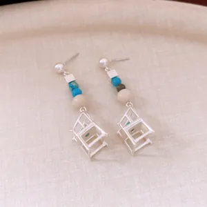 Silver needle pearl drop earrings with colorful beads and geometric chair pendant design