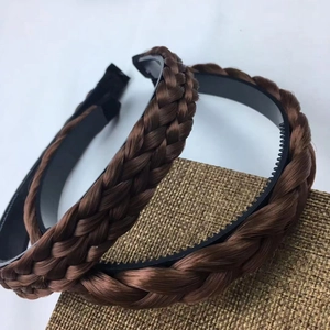 Close-up of brown braided headband with non-slip teeth and realistic hair texture