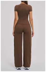 Detail of high-waisted wide-leg yoga pants with V-shaped seam for lifting effect