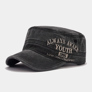 Detailed close-up of side embroidery on a vintage washed cotton military flat top cap