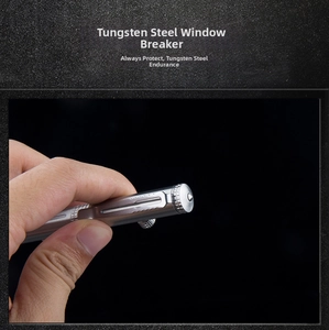 Macro detail of silver tactical pen with tungsten steel window breaker tip and metal clip