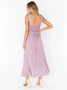 Detail of mauve sleeveless maxi dress with bow shoulder straps and smocked back design