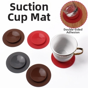 Detail of double-sided suction silicone coasters in red, brown, and grey with cup use