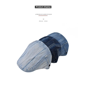 Detailed view of denim flat caps in various washes showing premium stitching and fabric texture
