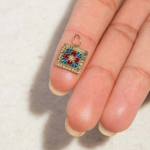Gold birth flower necklace pendant engraved with I Love You and enamel floral details