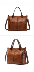 Close-up of caramel brown PU leather tote bag with dual zipper pockets and fine stitching