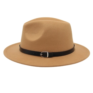 Close-up of camel wool fedora hat with a black leather band and silver metal buckle detail