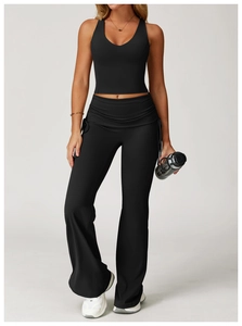 Detail of high-waist flared yoga pants with fold-over waistband and side drawstring design