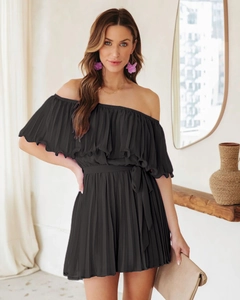 Detail of black off-shoulder pleated jumpsuit with elastic waist and matching belt