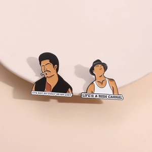 Enamel badges with movie character illustrations and Life's a Risk Carnal quotes