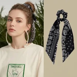 Elegant black paisley print scrunchie with streamer ribbons for stylish hair styling