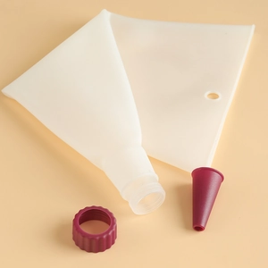 Silicone piping bag detail shot, pastry bag with coupler and tip for cake decorating.