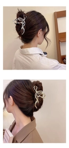 Detail of elegant gold and silver metal bow hair claws with pearl accents on hair