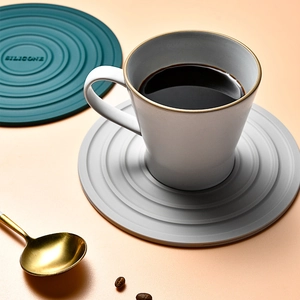 Heat-resistant silicone round trivets for kitchen in dark green and grey colors