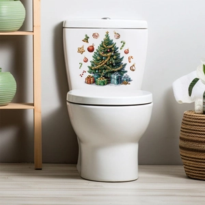 Detailed Christmas tree sticker with colorful gift boxes applied on a white toilet tank