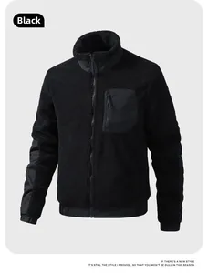 Detail view of black teddy fleece jacket featuring stand collar and nylon chest pocket
