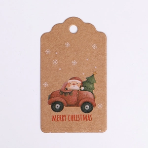 Brown kraft paper Christmas tag featuring Santa Claus driving a red car with a tree