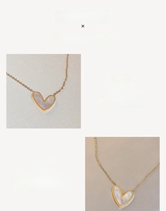 Detail view of heart-shaped mother of pearl pendant with gold plating on fine chain