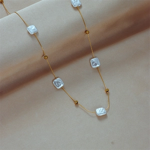French vintage style titanium steel necklace with square pearls and gold beads on silk