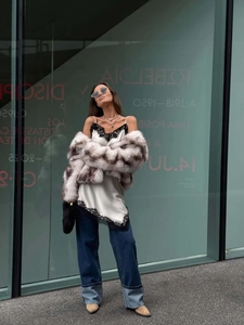 Cropped faux fur leopard coat styled with a white lace camisole and wide leg denim jeans