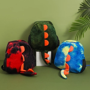 Three colorful plush dinosaur backpacks in red, green, and blue for kids and toddlers