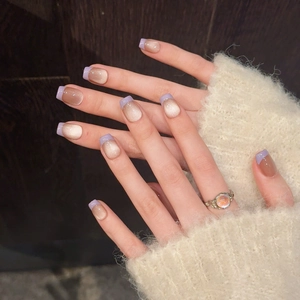 Handmade cat eye press-on nails with lavender french tips and nude gold shimmer