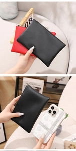 Litchi pattern PU leather pouches in red and black colors compared with a smartphone