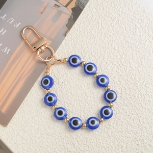 Vintage evil eye beaded keychain with blue resin beads and golden lobster clasp