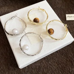 French style pearl and tiger eye stone hoop earrings set with hammered silver and gold finish