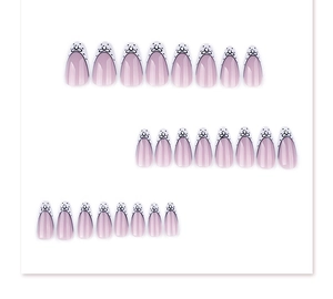 Detailed set of 24 almond-shaped press-on nails featuring purple gradient and bow designs