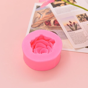 Macro view of detailed 3D rose petals inside a pink silicone fondant and soap mold